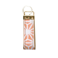 a photo of the back side of a keyfob made of batik in the pattern peach firework