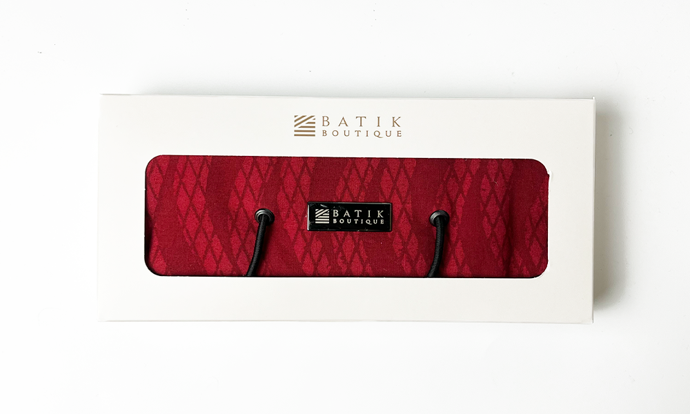 Elegant red snakeskin Batik Travel Roll Up Pouch, perfect for storing travel essentials, handcrafted with love.