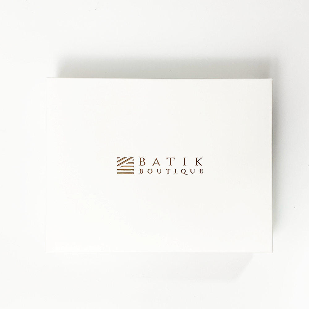 a white box with batik pocket square and batik neck tie easy to gift