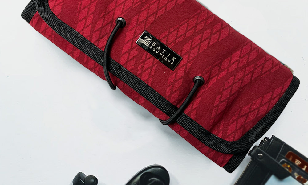 Batik Boutique's Red Snakeskin Travel Roll Up Pouch, a stylish and practical accessory, ideal for organizing your essentials.