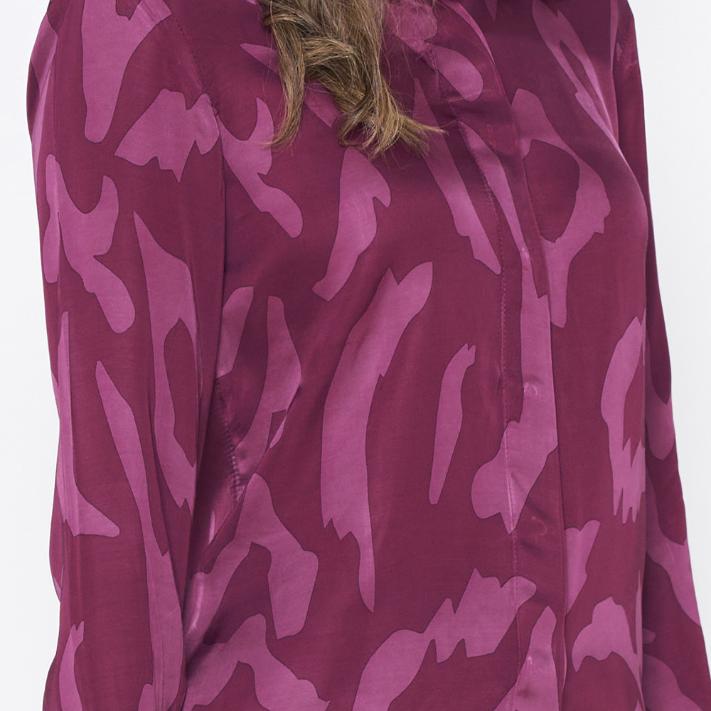 a closeup of the print plum rimba against a white background