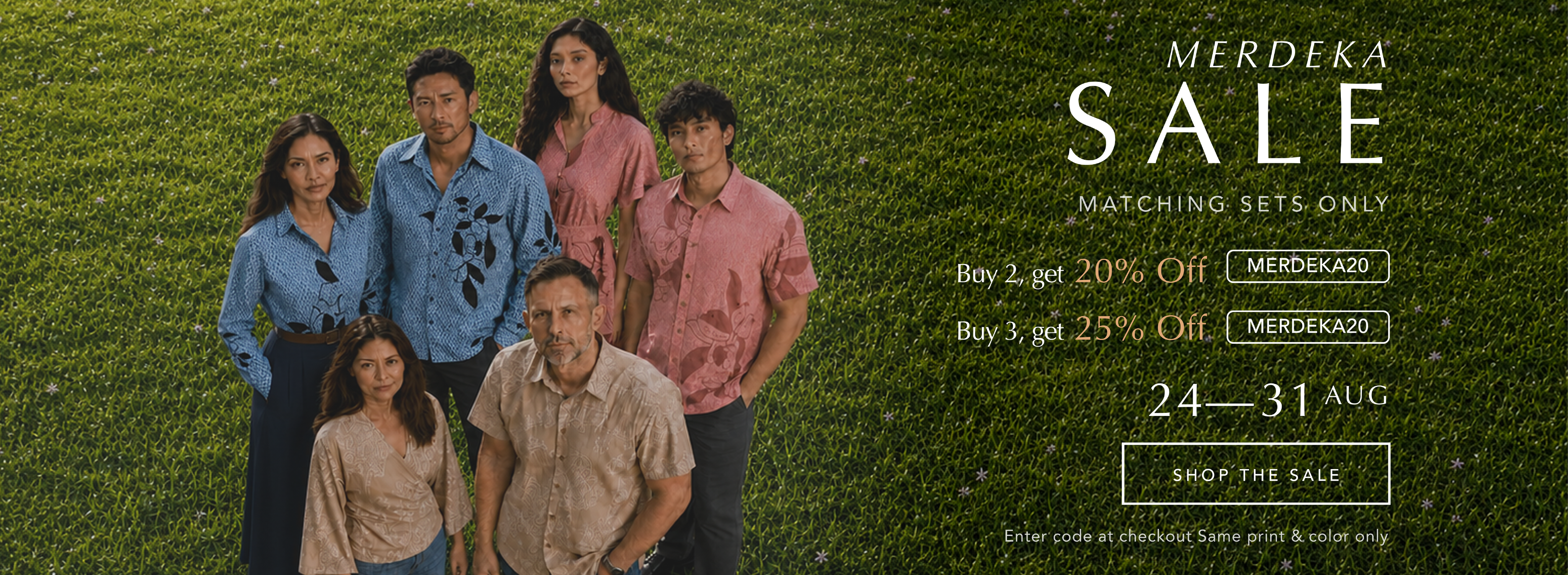 Banner showing people in matching batik posing at the field