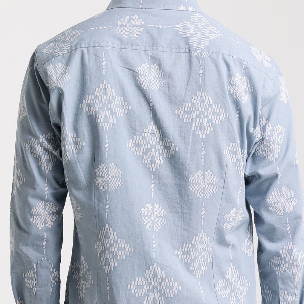 Diamond songket shirt shown in a white box background  with geometric pattern on a white background