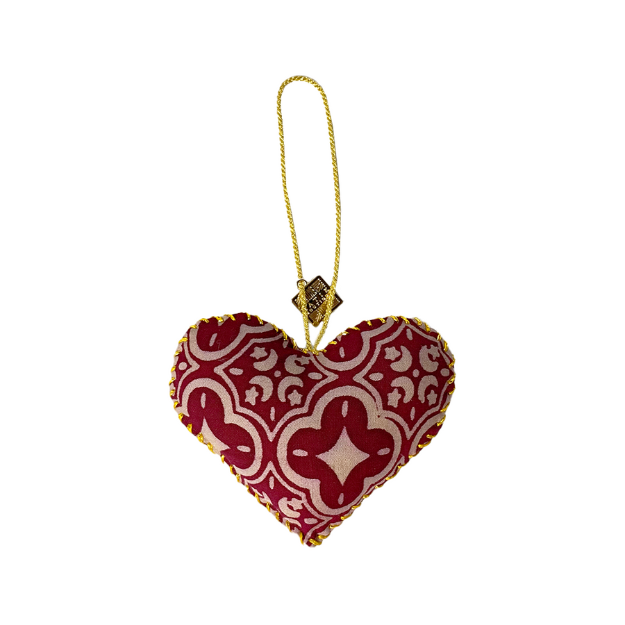 A whitebox photo of handmade heart ornaments in crimson celestial pattern 