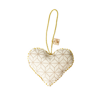 A whitebox photo of handmade heart ornaments in crimson celestial pattern showing backside of the ornaments