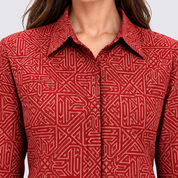 Closeup of lady wearing red batik shirt