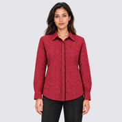 Woman facing the front wearing red batik shirt