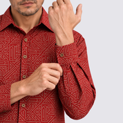 Closeup of sleeve of red batik shirt