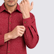 Closeup of man wearing red batik shirt