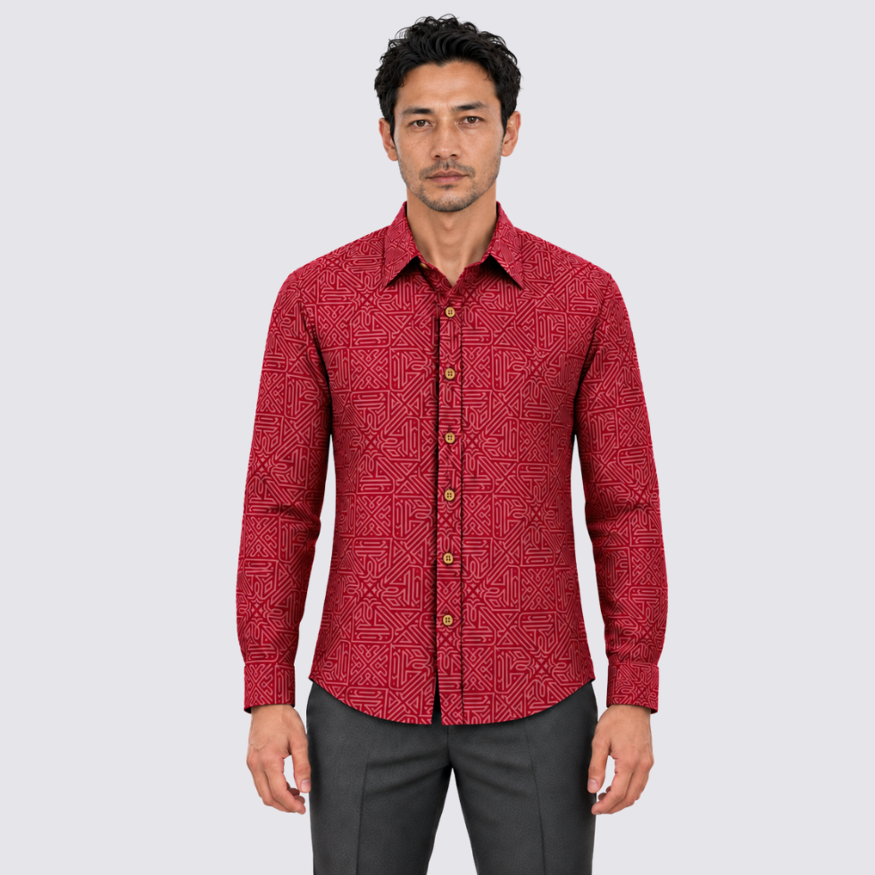 man wearing red batik shirt facing the front
