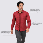 Man wearing red batik shirt with labelled features