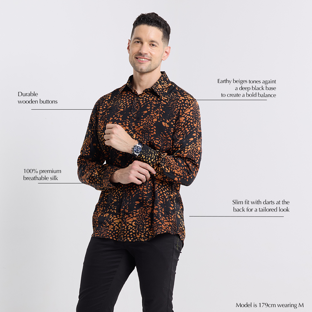 Front view of Batik Boutique’s Black Leopard Silk Batik Shirt highlighting slim fit tailoring, durable wooden buttons, and breathable 100% silk fabric with earthy beige patterns on black base