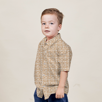 a young model posing in a batik shirt in the pattern latte kompas against a white background