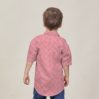 a young model posing in a batik shirt in the pattern rose bintang against a neutral background
