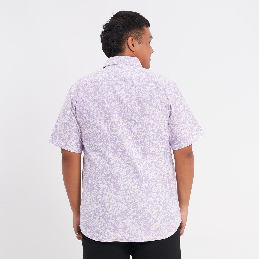 a shot of the back of a batik shirt in the pattern lilac floret to showcase the details on the back