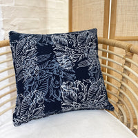 A lifestyle photo of batik pillow cover in blue nautical fern pattern