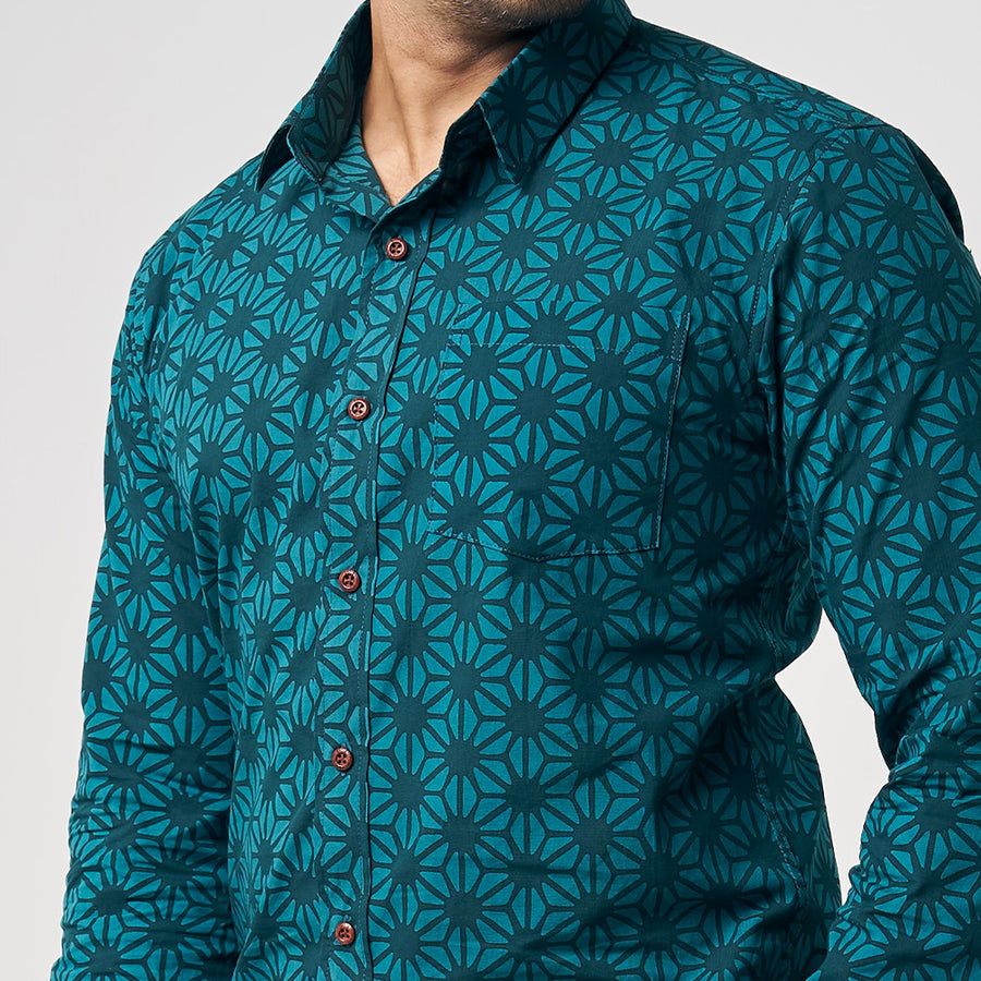 A captivating close-up shot highlighting the intricate details of an authentic Forest Firework patterned batik shirt against a neutral background