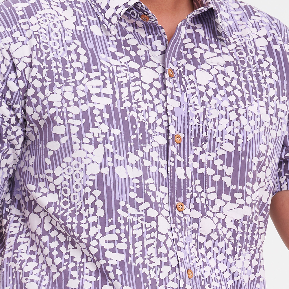 a closeup shot of a batik shirt in the pattern lavender bintik