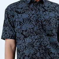 a close up of the pattern jet rumpai a batik shirt in front of a white background