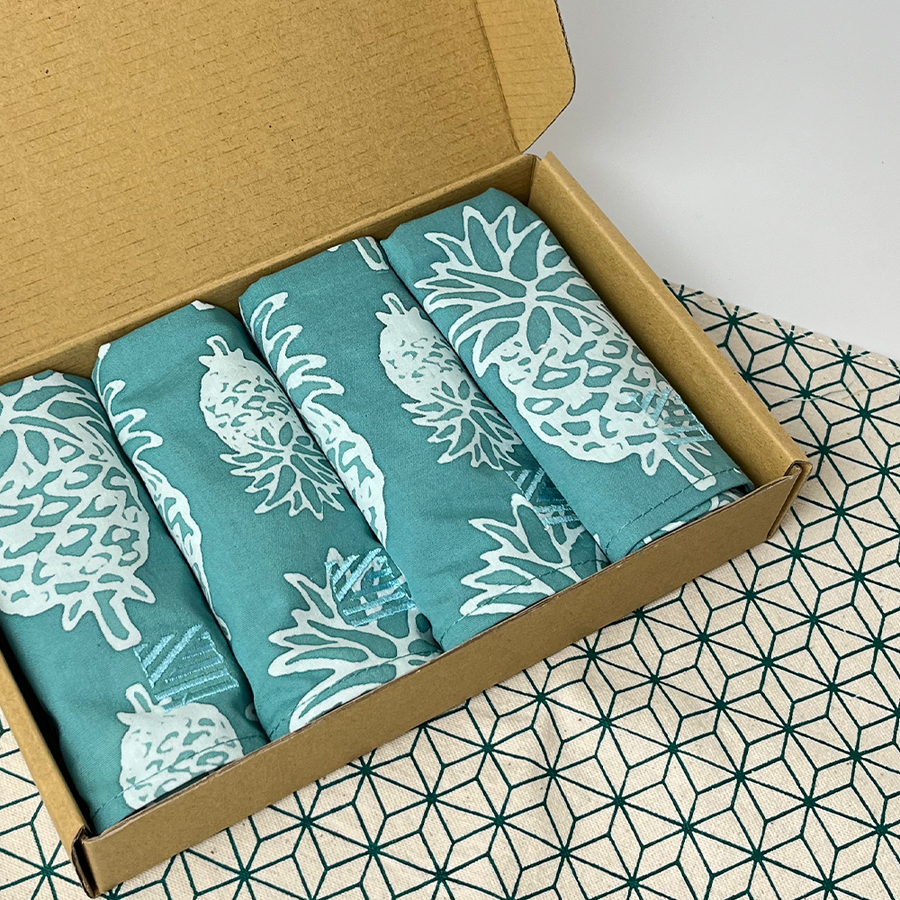 a picture of a batik serviette set in a box against a neutral background in a set of 4