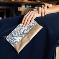 A woman hand holding batik zip pouch in Grey Peony pattern
