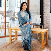 woman seated wearing the batik craftan pareo