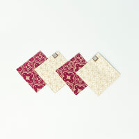 A whitebox photo of 4 pieces of  batik coaster lay on top of white background. 