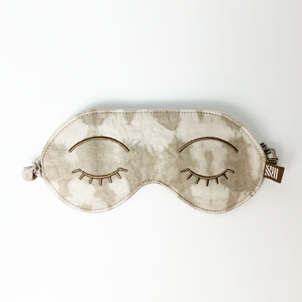 a white box photo of a shibori eye mask in the pattern mangosteen