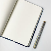 Navy hibiscus inspired notebook show with a pen 