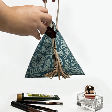 ketupat bag in a lifestyle photo batik in the pattern teal ukir