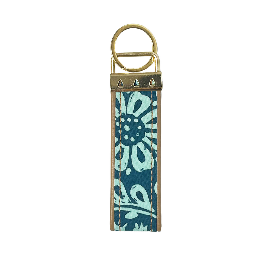 a picture of a batik key fob in the pattern teal ukir against a white background