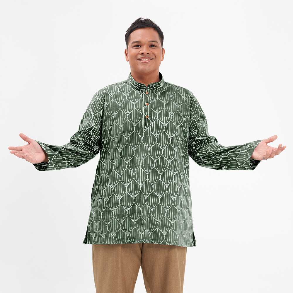 a male model posing with batik kurta in the pattern olive bawang