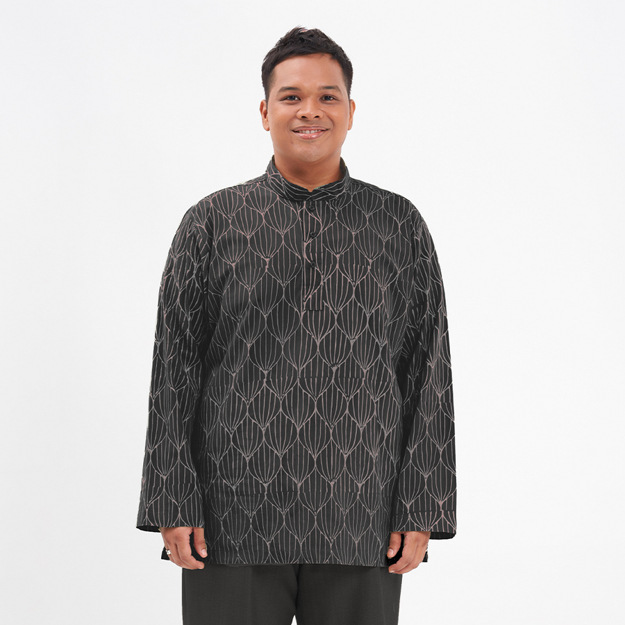 a male model in posing a batik kurta in the pattern jet bawang against a white background showcasing the front of the batik shirt