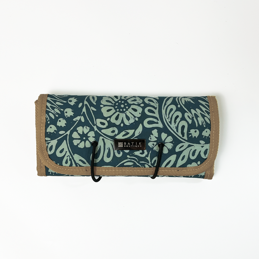 a photo of Batik Roll Up Travel Pouch made of batik in the pattern Teal Ukir against a white background