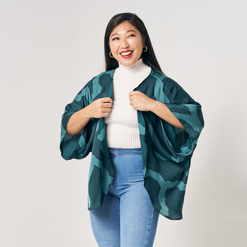 A women model is posing in kimono cardigan. In pattern forest chain