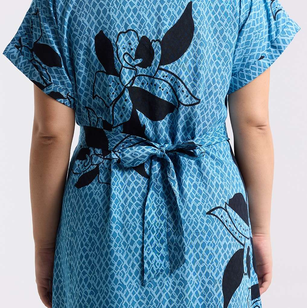Detailed photo of the blooming lace azure dress showing the tie back function 