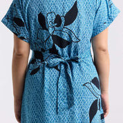 Detailed photo of the blooming lace azure dress showing the tie back function 