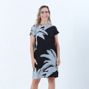 batik dress against a white background in the pattern midnight palmera front view