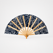 A traditional folding hand fan with a navy blue and white patterned fabric and natural bamboo ribs, displayed open against a clean white background.