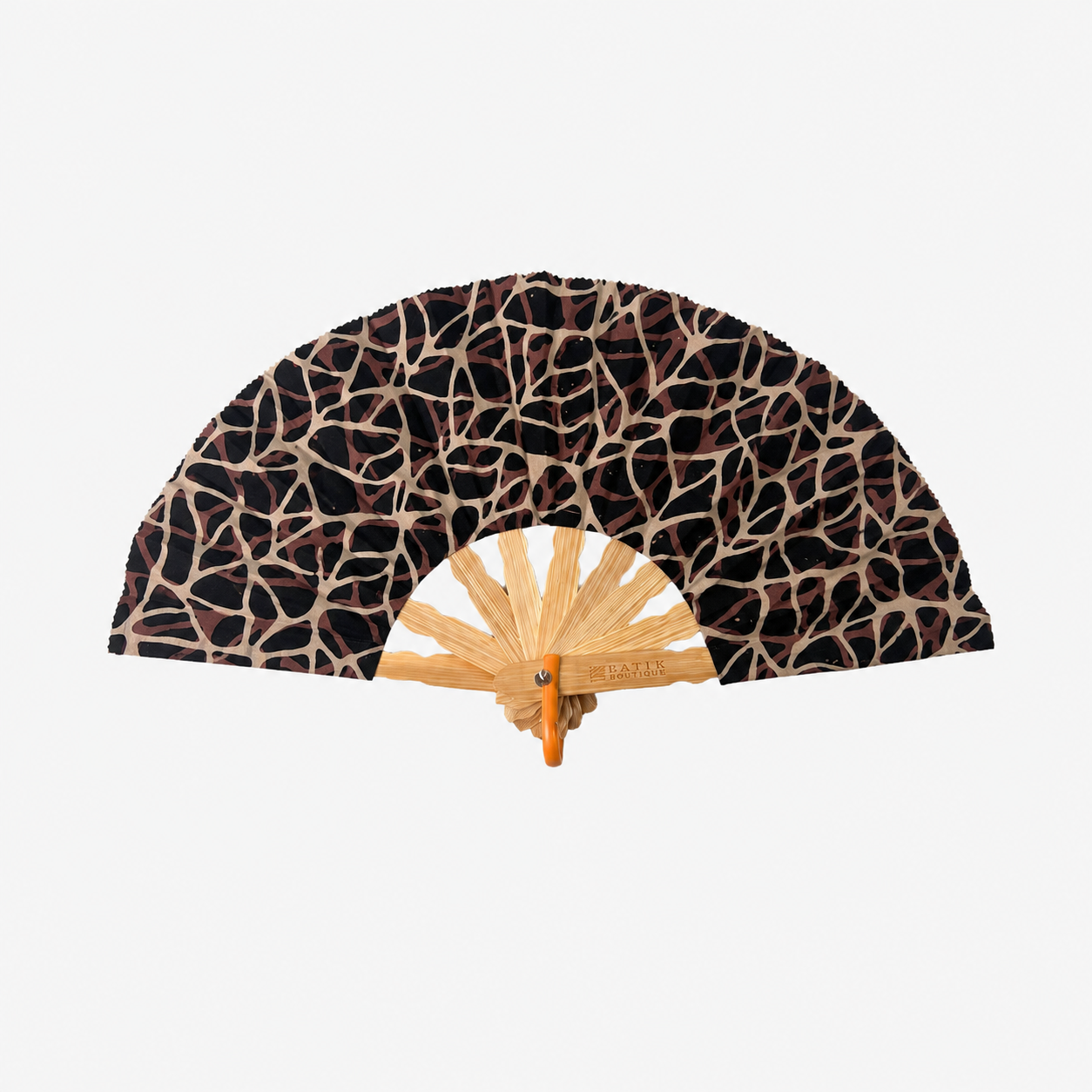 A folding hand fan with a black and beige abstract web-like patterned fabric, a light natural wood handle, and a small metal brand plaque reading 'SOUVENIR'.