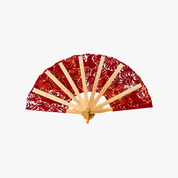 A traditional Japanese folding hand fan with a red and white floral patterned fabric and natural bamboo ribs, shown open against a plain white background.