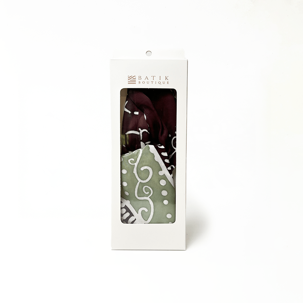 Packaged batik fabric with visible brand name on a white background