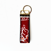 Keychain with red and white design on a white background