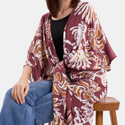 Woman wearing maroon kimono, focusing on close up features