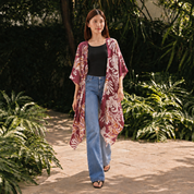 Girl wearing maroon kimono walking outside