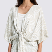 Closeup details of a grey printed batik kimono being tied up