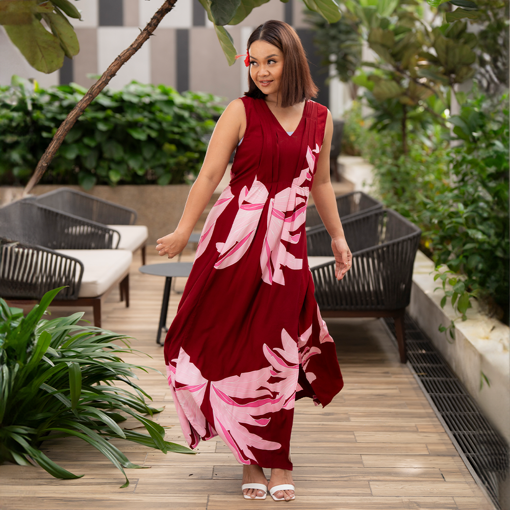 a woman in a lifestyle photo wearing a batik dress in the pattern berry palmera