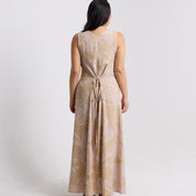 Back view of the  tan orchid maxi dress  showing the ties knotted in the back