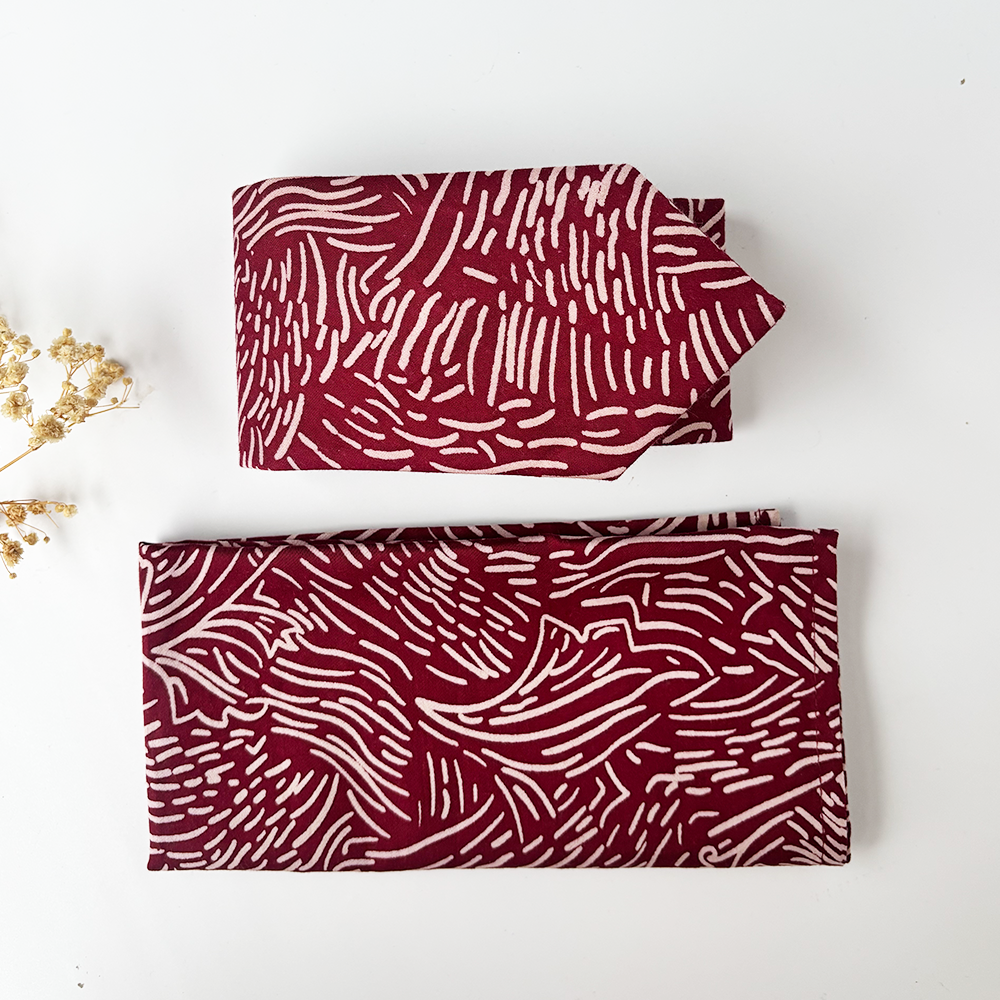 Folded up Crimson driftwood tie and crimson driftwood pocket square 