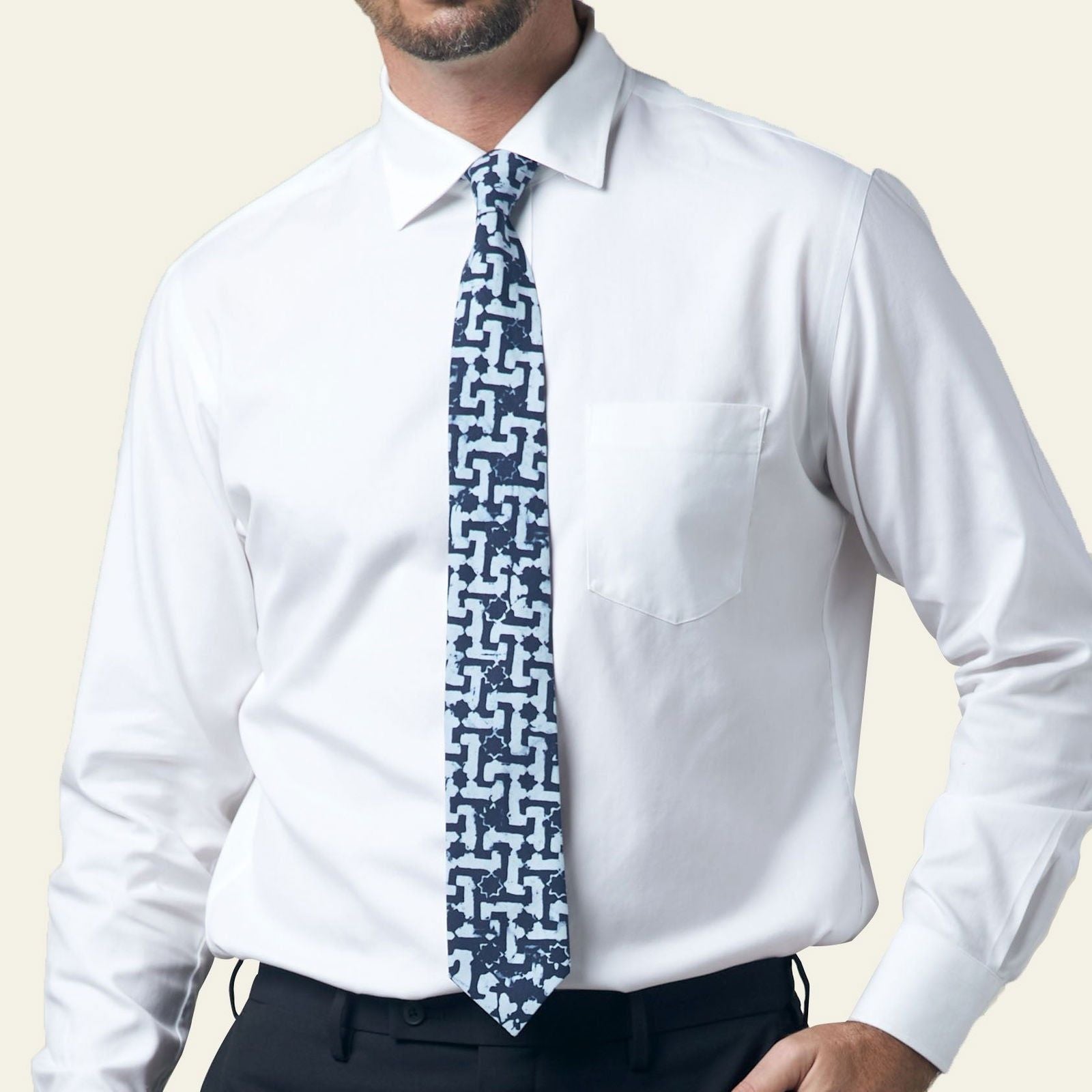 Batik Neck Tie & Pocket Square (Silk Cotton) - Midnight Arabesque being worn on a white shirt 